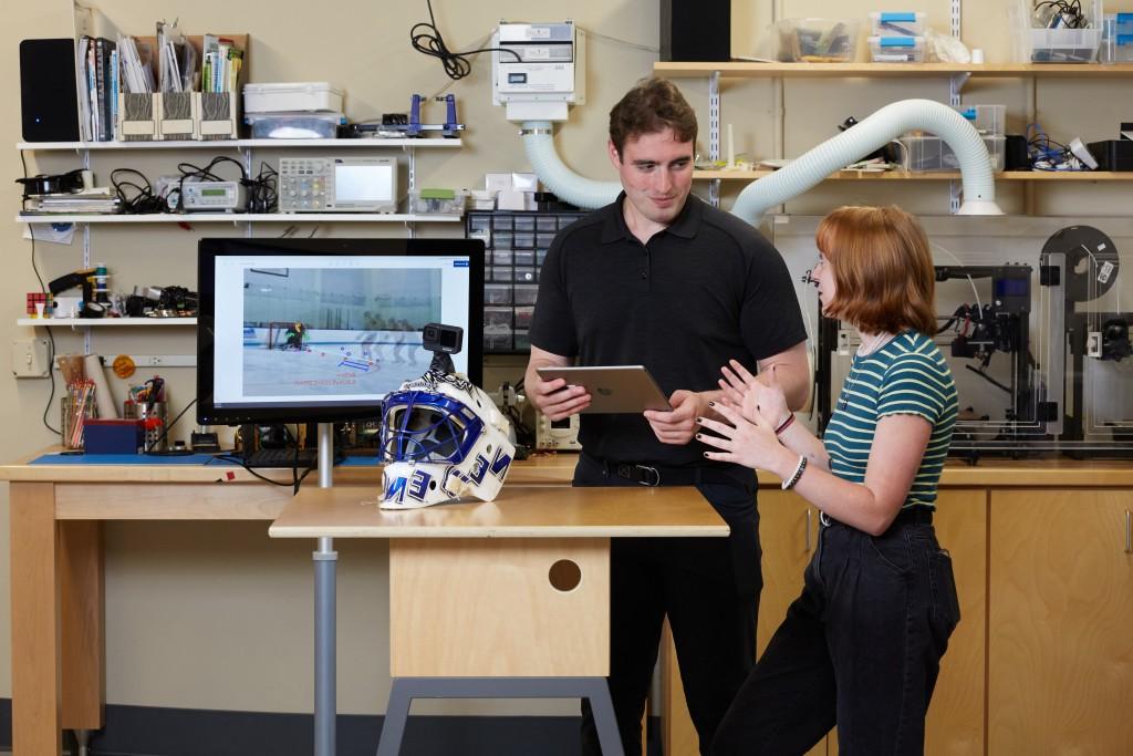 Two U N E students work together in the Makerspace